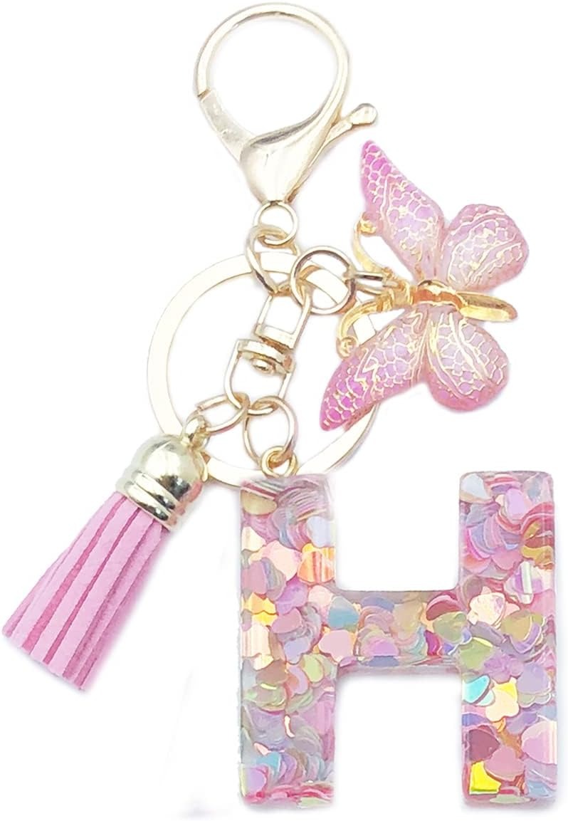 Keychain with butterfly, tassel, and letter 'H' charm